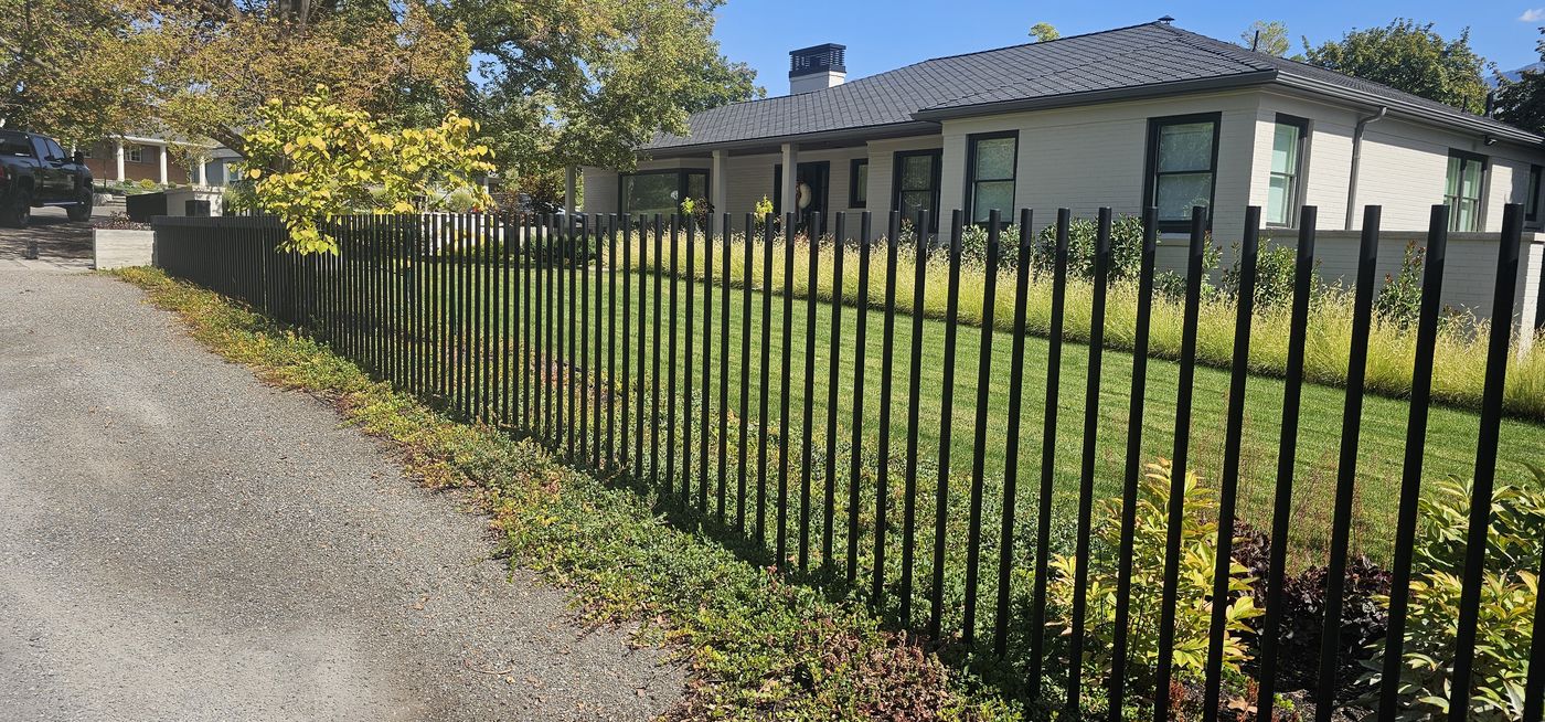 Steel fence line along drive, Millcreek