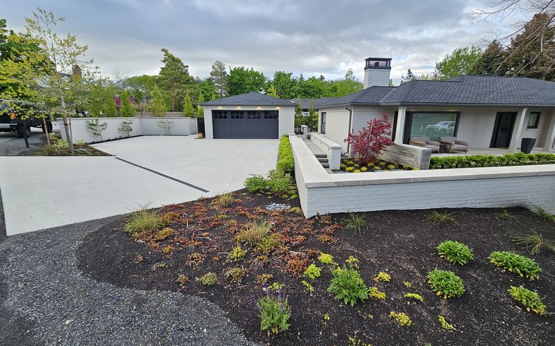 Board-formed concrete retaining wall with planting bed, Millcreek