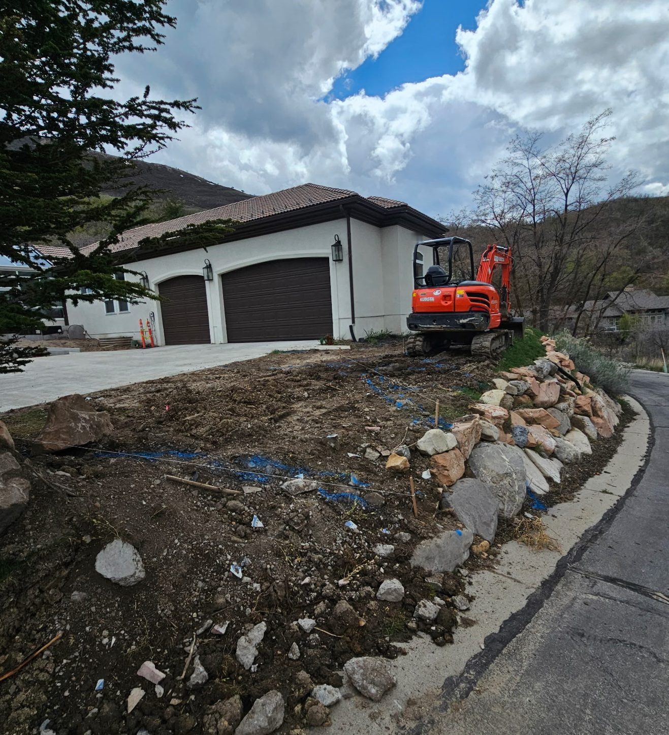 Emigration Canyon Residence: excavation with boulder edging