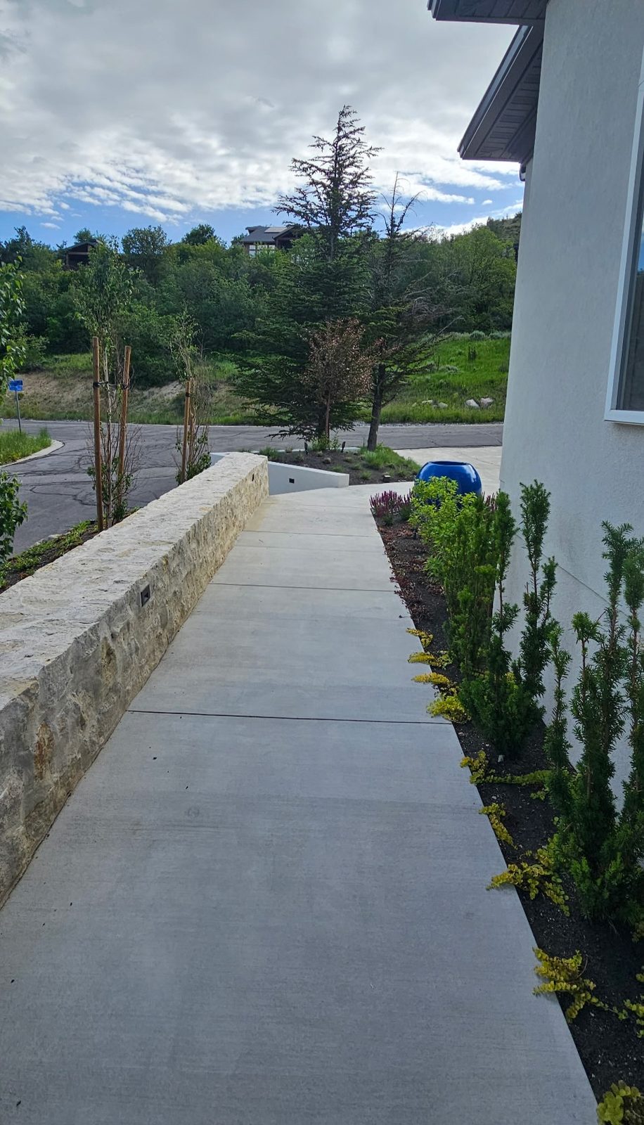 Emigration Canyon Residence: walkway along a stone wall